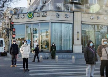 China softens tone on COVID severity after protests