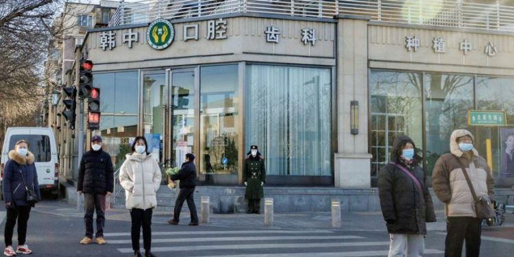 China softens tone on COVID severity after protests